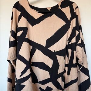 black and beige long sleeve top